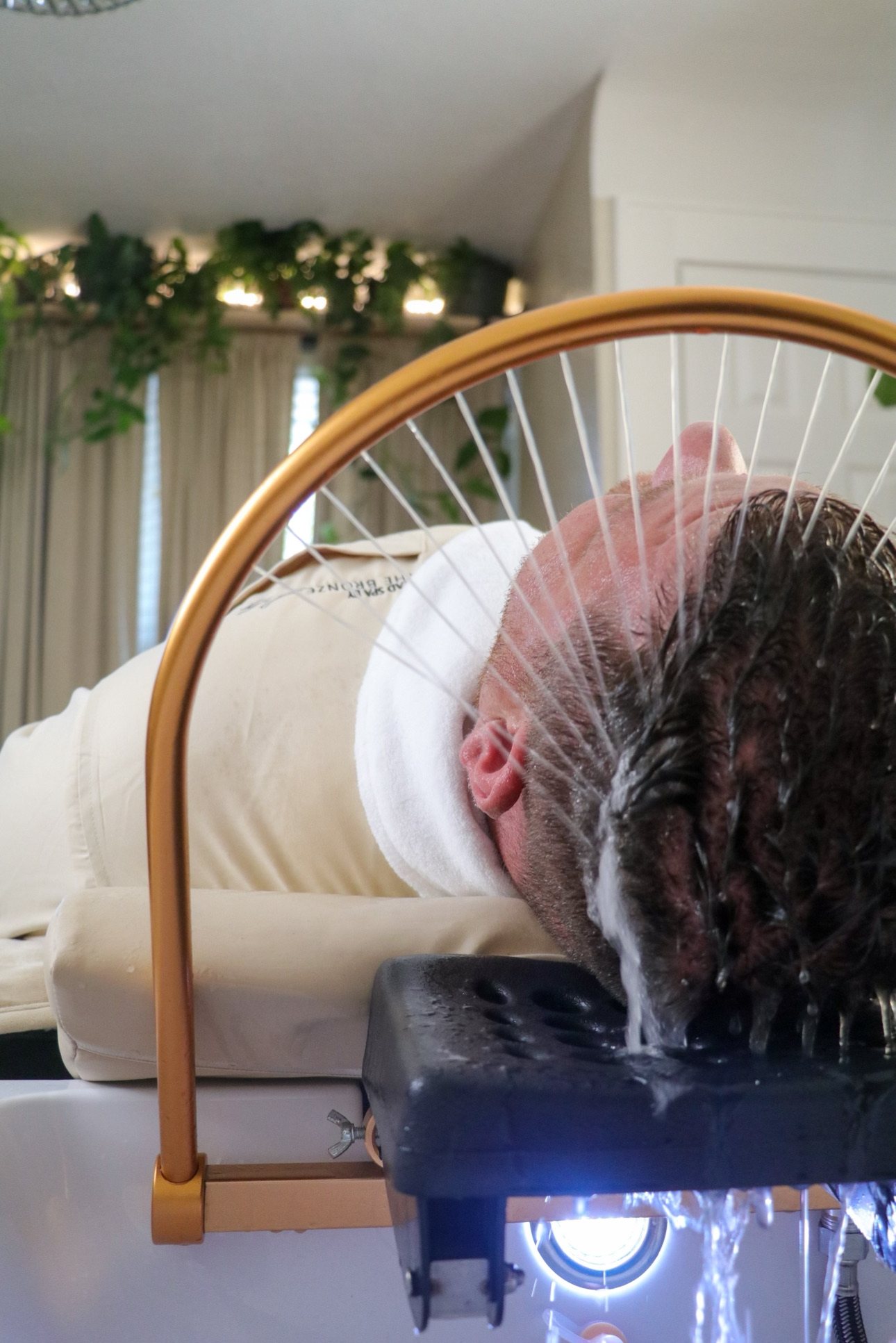 Man receiving a Japanese head spa and beard treatment — The Bronze Lily, St. Petersburg, FL