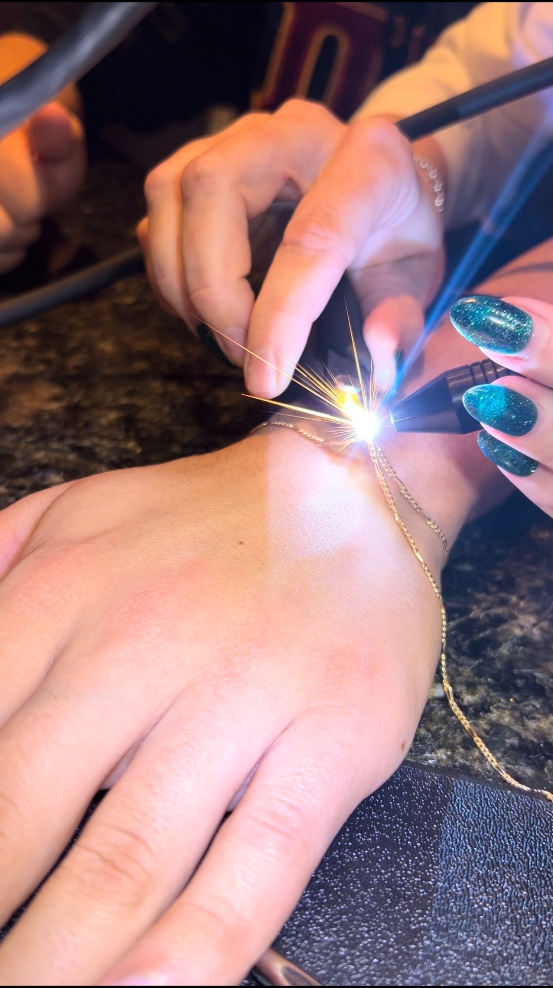 Lifestyle, welded bracelet on the wrist, candid — The Bronze Lily, St. Petersburg, FL