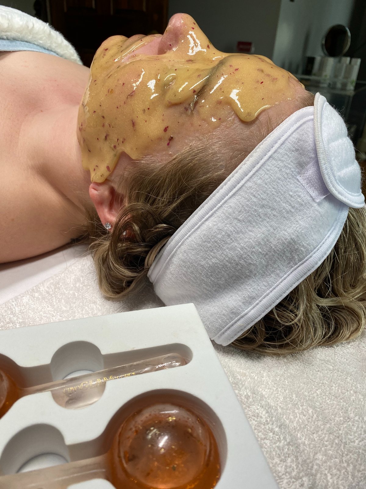 The Amara Ritual, Meg working with warm stones — The Bronze Lily, St. Petersburg, FL